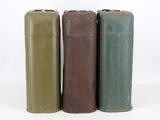 four different colors of metal containers sitting next to each other on a white surface