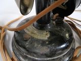 a close up of a vintage sewing machine on a table