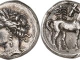 a silver coin with an image of a horse and a man on it