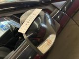 a parking meter on the side of a car with a sticker attached to it