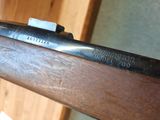 the rifle is sitting on the table ready to be used