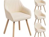 quatre chaises à pieds en bois, une chaise rembourrée blanche, une chaise rembourrée beige et une chaise rembourrée blanche avec une chaise rembourrée beige