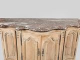 a marble top cabinet with a marble top on it