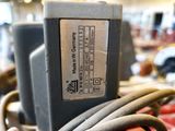 a close up of a machine with wires attached to it