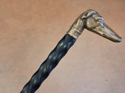 an image of a close up of a cane with a bird head on it
