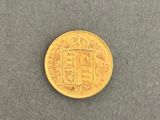 a gold coin with a coat of arms on it