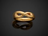 an image of a gold ring on a black surface