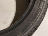 a close up of a tire on a white surface