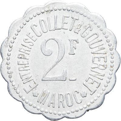 an image of a silver coin with the number twenty on it