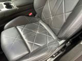 a close up of a seat in a car with a cup holder