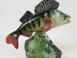 a figurine of a fish with a hat on it ' s head