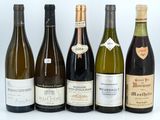 several bottles of wine are lined up in a row on a white surface