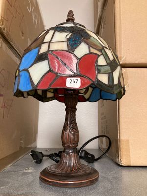 a lamp that is sitting on a table next to a box