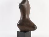 bronze sculpture of a female torso on a black square base