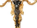 an image of a wall sconce with a statue of a woman holding a candelier