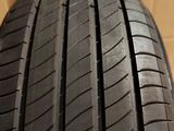 a close up of a tire on a box with a cardboard box in the background