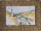 une photo d'un tableau représentant une ville, dans un cadre doré