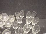 a lot of empty wine glasses sitting on a table