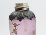 a purple glass vase with a gold leaf design on it