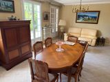 a dining room with a table and chairs in it