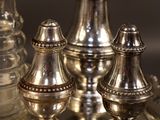 a lot of silver objects sitting on a silver tray