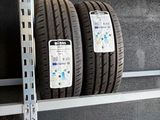 two tires that are on a shelf in a store