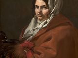 portrait of a woman holding a rooster by person