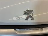 a close up of a badge on a car ' s hood