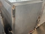 a metal box that is sitting in the middle of a room