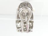 a silver ring with a diamond in it on a clear surface