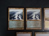 four cards of the same type of card are on a table