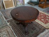a table that is sitting on a rug in a room