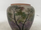 a vase with a painting of a tree on it