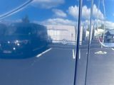 a reflection of a car on the side of the road