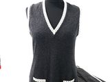 a dress on a mannequin with a scarf on it