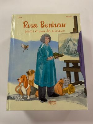 a book with a picture of a woman in a blue coat