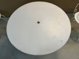 a white table and two chairs sitting next to each other