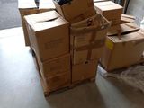 a pile of boxes sitting on the floor in front of a garage door