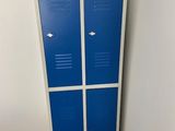 two blue lockers next to each other in a room