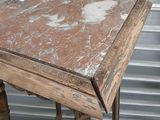 a small table with a marble top on a stand