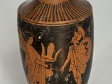 un vase orné d'un motif noir et orange
