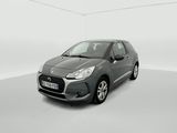 a grey car in a white room with a white floor