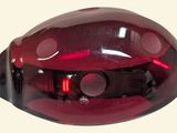 an image of a red glass object on a white surface
