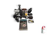 a lot of cameras and a book on the table
