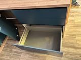 a drawer that is open on the floor in a room