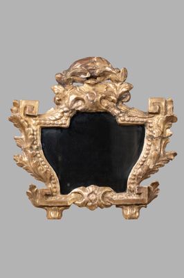 a gold frame with a lion head on it