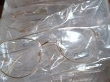 many pairs of glasses in a box on a table