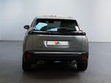 the rear of a silver suv parked in a large room