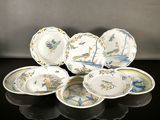 a group of plates and bowls sitting on a table