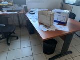 a desk with a computer and a box on top of it